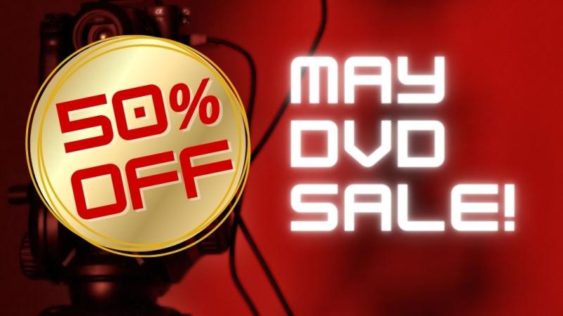 Gold circle with text in red 50% off next to white text that reads may dvd sale! over a red background with black blurred camera image
