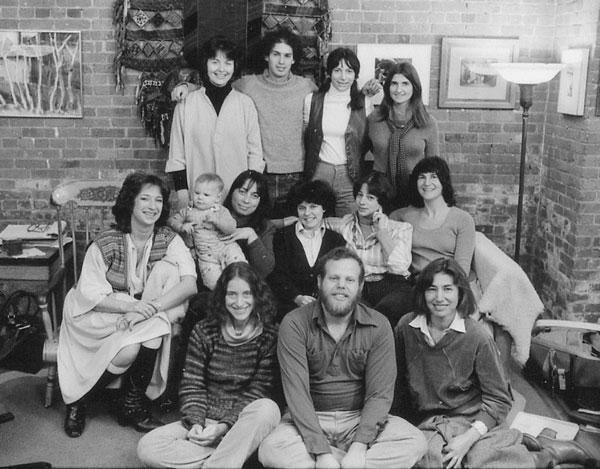 A dozen New Day Films members and one baby pose for a group shot in 1978.