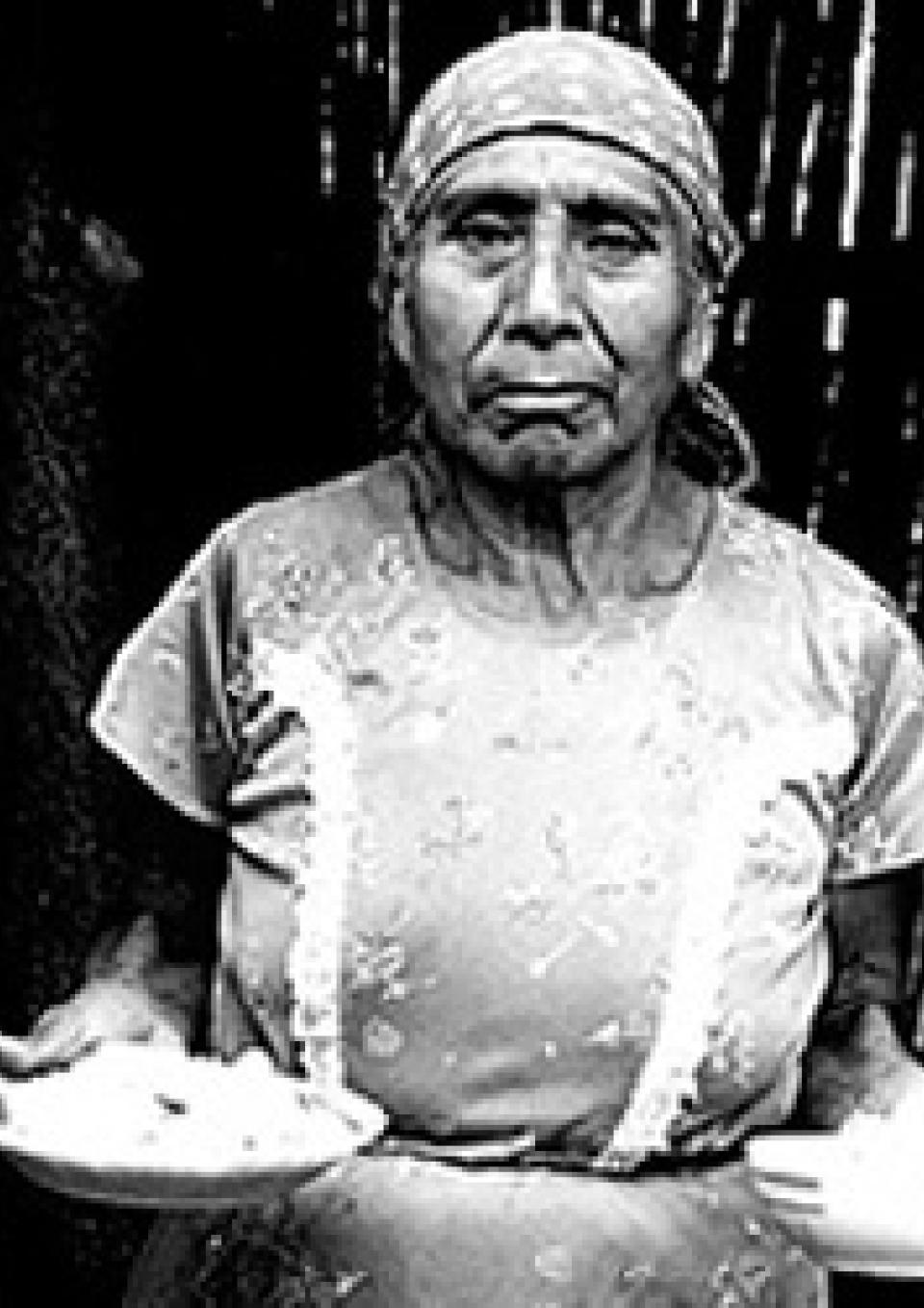 Poster of Mayan woman holding bowls of maize