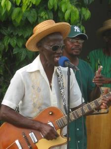 Jamesie Brewster playing guitar on St. Croix