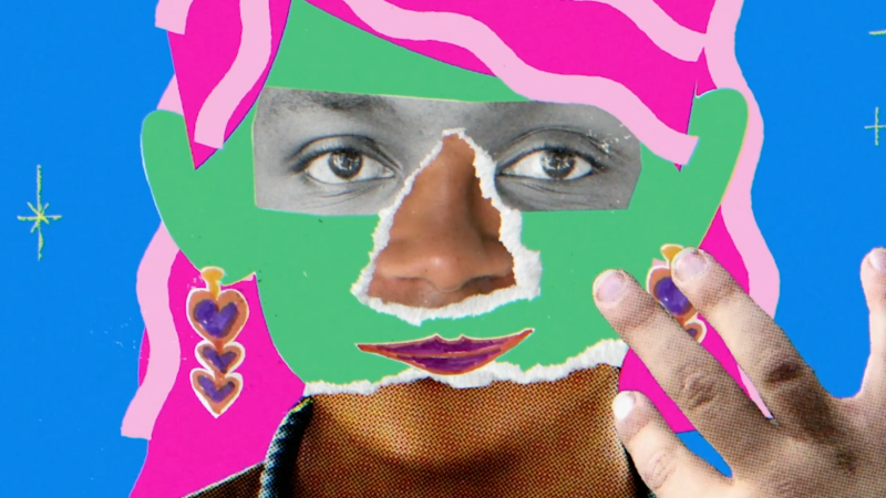 A still from Mama Has A Mustache featuring a face with green and purple over it that looks like cutouts from paper.