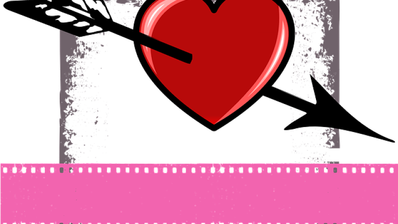 A drawing of a bright red heart pierced by an arrow framed by a grungy gray box with a pink film strip spanning along the bottom of the image.