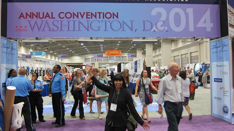 New Day Filmmaker Leena Jayaswal stands outside the bustling exhibition hall, near a large banner that reads “Annual Convention Washington D.C. 2014.” She smiles and strikes a pose.