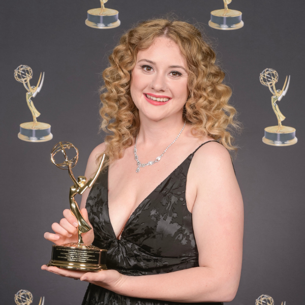 Melody Miller holds her Emmy