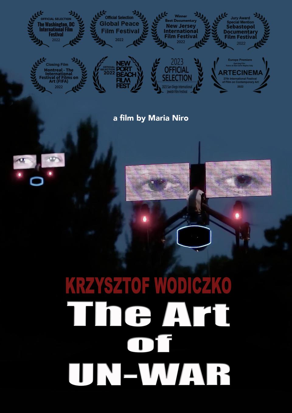 Image of a drone with a screen attached above the drone eyes are projected on the screen. The Drone is suspended in the air above trees and there is a blue sky in the background. Title of film appears The Art of Un-War. 