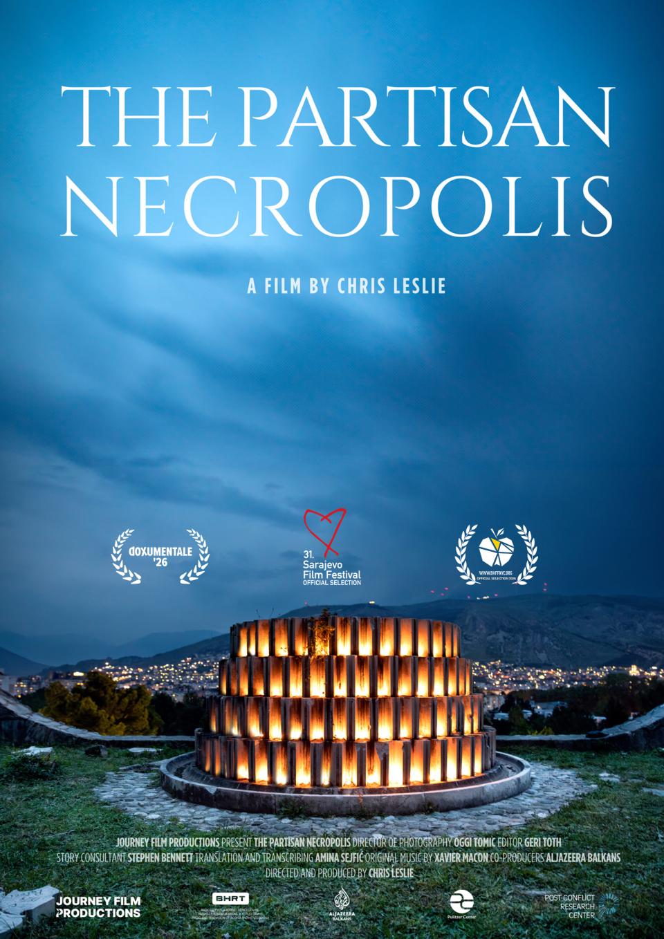 A scenic view of the Partisan Memorial Cemetery in Mostar, Bosnia and Herzegovin. In a deeply rich sky the film title appears in white, all-caps font: "THE PARTISAN NECROPOLIS"
