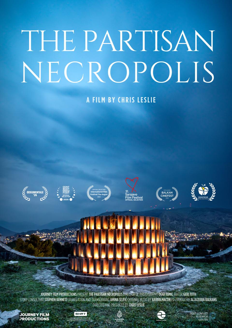 A scenic view of the Partisan Memorial Cemetery in Mostar, Bosnia and Herzegovin. In a deeply rich sky the film title appears in white, all-caps font: "THE PARTISAN NECROPOLIS"