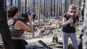 Filmmaker, Kate Schermerhorn, filming fire victim.
