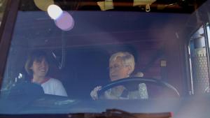 Sandi and filmmaker Amy Reid riding in Sandi's truck