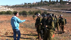 Palestinian man with Israeli soldiers