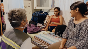 (Las Abogadas): Production Still 1 - Attorney Rebecca Eichler meets with migrants at a shelter in Mexico
