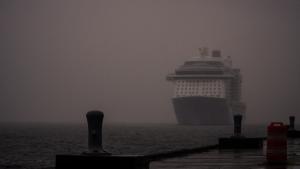 A cruise ship looms on the horizon.