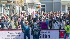 A crowded, tourist-filled main street of Sitka, Alaska shows how packed this small village gets once a tourist ship docks.