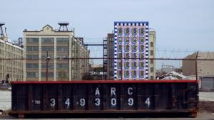 A colorful mural on an industrial building.