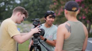A film crew discussed equipment in cemetery