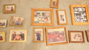 An assortment of framed photos scattered across the ground