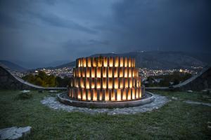 The foundation and centre piece of the Partisan Memorial Cemetery lit up at night in homage to the site and its architect - Bogdan Bogdanovic 