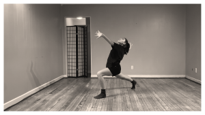 Black and white image of Telephone dancer Camille in a deep lunge