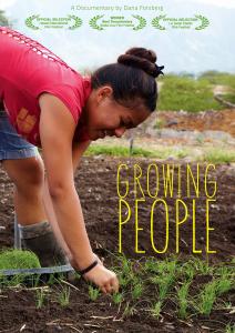 A young Hawaiian woman in shorts and a sleeveless shirt in a field, bending over, planting tiny vegetable starts. Her long brown hair is braided and hangs over her head, almost touching the ground. It is a bright sunny day. Title, "Growing People" and a row of film festival award laurels.