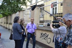 Judy and Tess with Ukrainian guide outside Warsaw orphanage.JPG