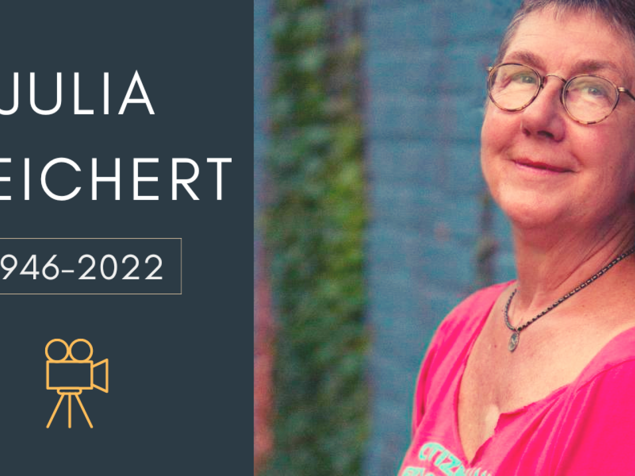 Text reads julia reichert 1946-2022 with an icon of a camera underneath with a photo on the right of a white woman with cropped hair wearing glasses and a pink top against a blue wal