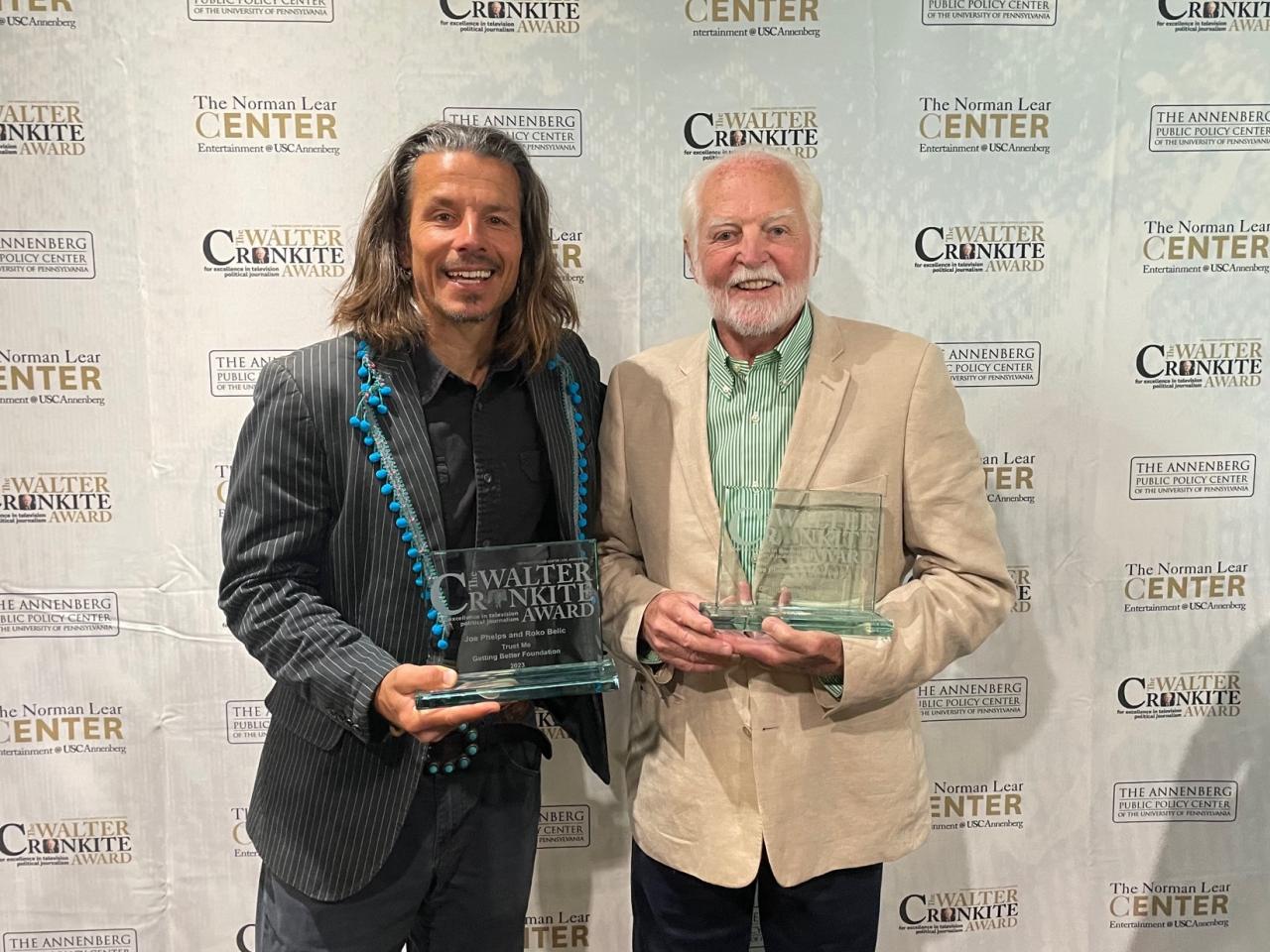 Joe Phelps (R) and Roko Belic (L) receiving the Walter Cronkite Award for “Trust Me”
