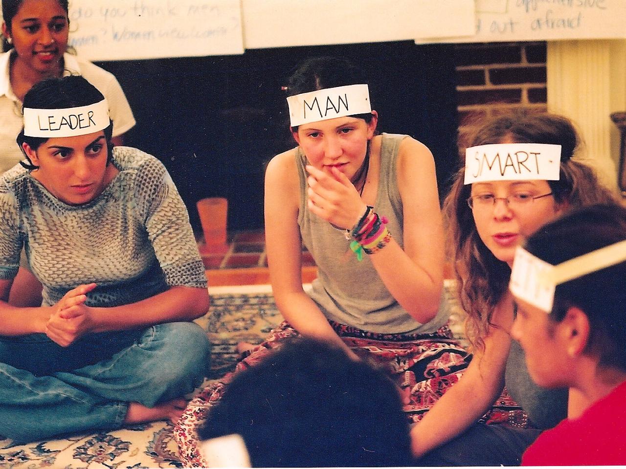 teenage girls sitting on floor