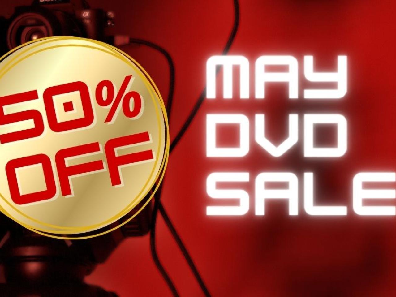 Poster for the May DVD sale! A gold circle with text in red “50% off.” The background is blurry red with a camera behind the gold circle.